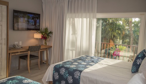 Suite junior, 2 camas de matrimonio, vistas al jardín