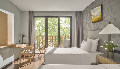 Habitación Deluxe con 2 camas individuales, varias camas, balcón, vistas al jardín