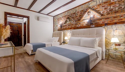 Habitación triple, vistas al mar