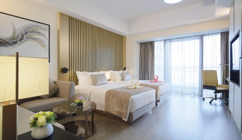 Habitación superior con 2 camas individuales, vistas a la ciudad