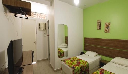 Habitación triple, varias camas