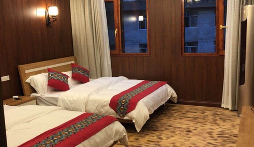 Habitación Elite con 1 cama doble o 2 individuales