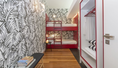 Habitación cuádruple Deluxe, varias camas, vistas al jardín (ARANCIONE)