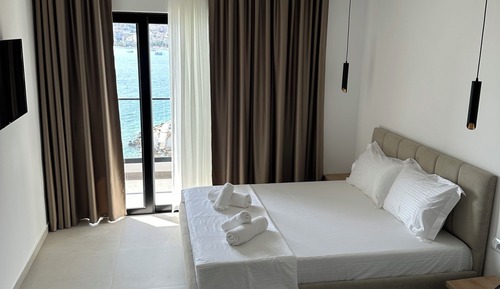 Habitación triple, vistas al mar