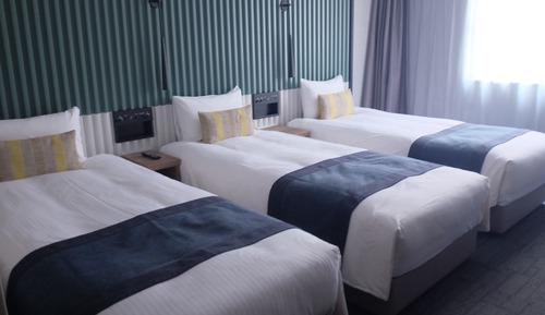 Habitación triple Deluxe (Bed Type: Single bed is arranged)