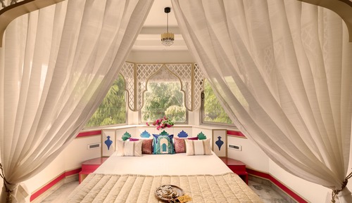 Mughal heritage room with 180 degree city view from Designer bed