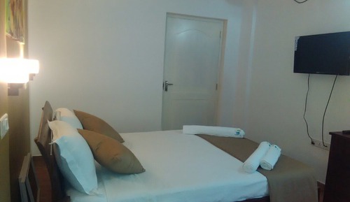 Habitación triple Deluxe, varias camas