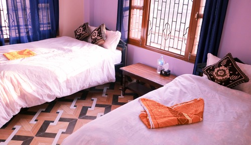 Habitación triple Deluxe, varias camas, no fumadores, vistas al jardín