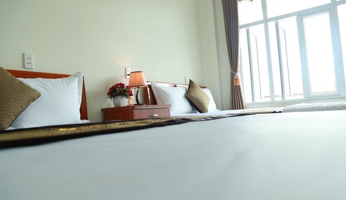 Habitación cuádruple estándar, 2 camas de matrimonio, no fumadores, vistas a la ciudad