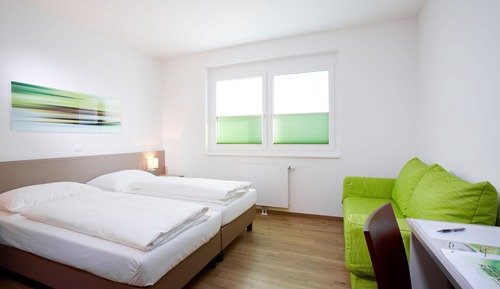 Habitación triple, varias camas
