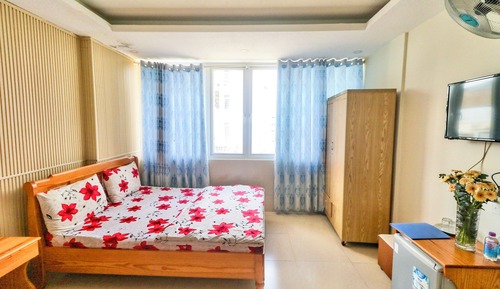 Habitación cuádruple Deluxe, 2 camas de matrimonio, frigorífico, vistas a la ciudad