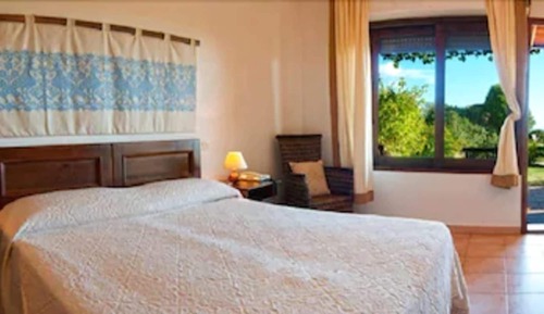 Habitación triple Confort, en la zona del jardín