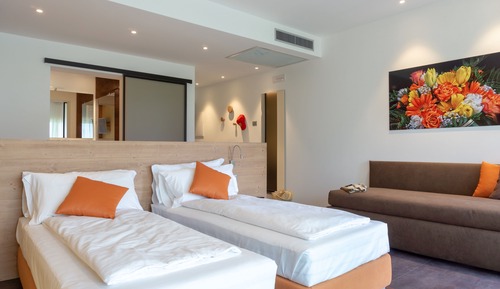 Habitación triple Deluxe, varias camas