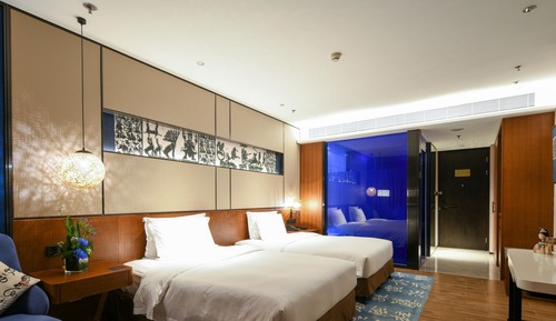 Habitación Elite con 1 cama doble o 2 individuales