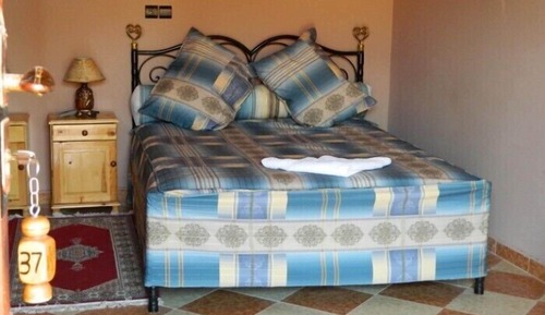 Habitación triple, varias camas