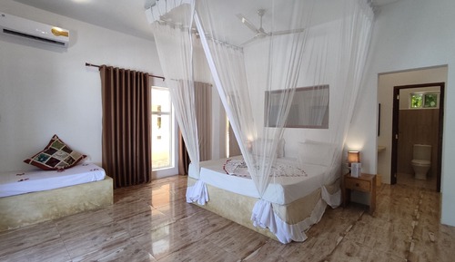 Habitación triple Deluxe, vistas al jardín