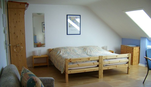 Habitación triple, cocina básica