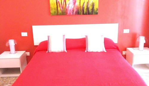 Habitación Deluxe doble, varias camas, balcón