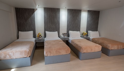 Habitación cuádruple Deluxe, varias camas