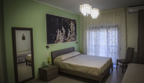 Habitación triple, varias camas