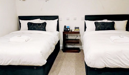 Habitación cuádruple Deluxe, 2 camas dobles