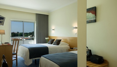 Habitación triple, varias camas