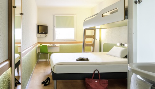 Habitación triple, varias camas