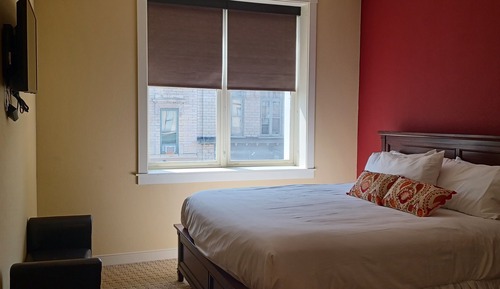 Suite Deluxe, varias camas, bañera de hidromasaje, vistas a la ciudad