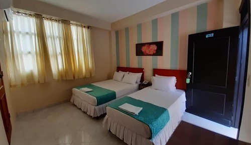 Habitación triple superior, varias camas