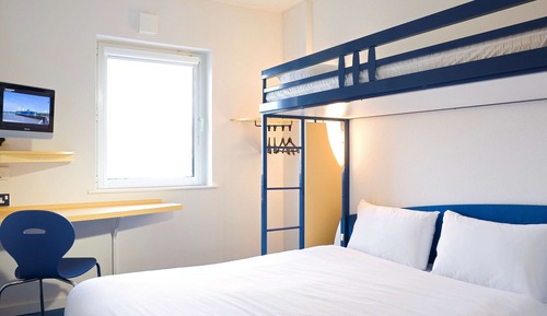 Habitación triple, varias camas