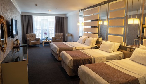 Habitación cuádruple Deluxe, varias camas