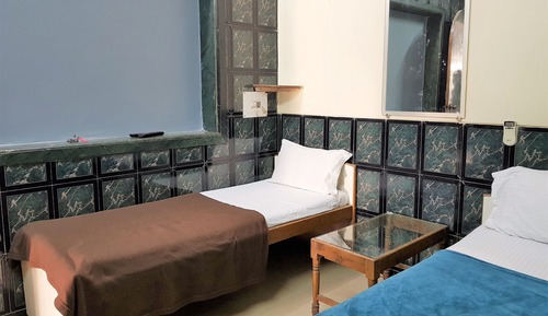 Habitación triple Deluxe, varias camas