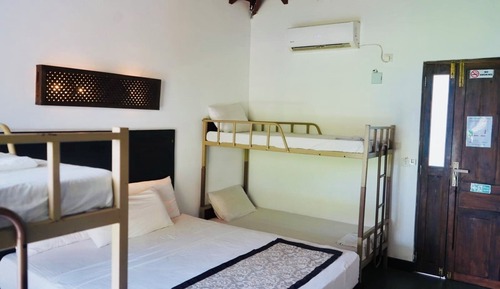 Habitación económica, varias camas