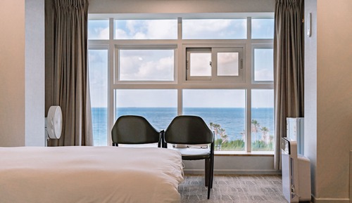 Habitación Deluxe con 2 camas individuales, vistas al mar, frente a la playa