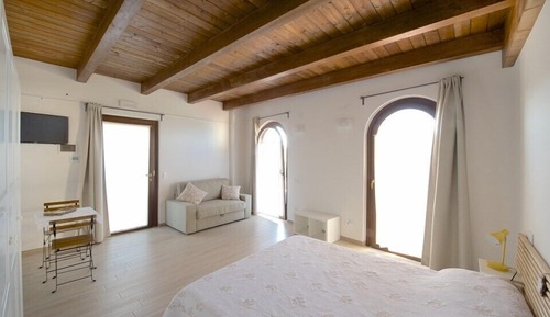 Habitación triple Deluxe, varias camas