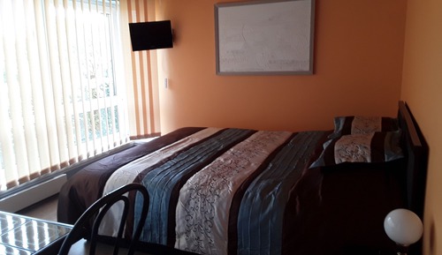 Habitación triple clásica, vistas al jardín