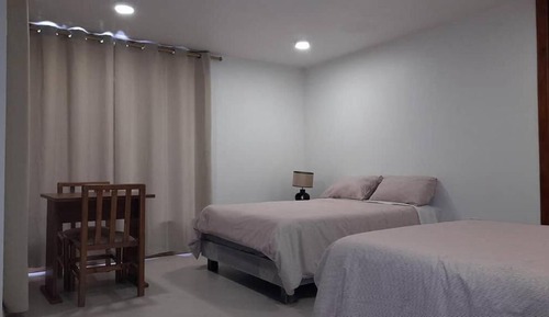 Habitación Deluxe, dormitorio mixto, vistas al jardín