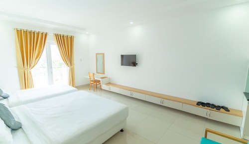 Habitación triple Deluxe, vistas parciales al mar