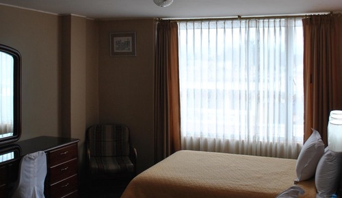 Habitación triple, varias camas