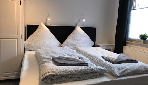 Habitación triple Confort, varias camas, vistas al jardín