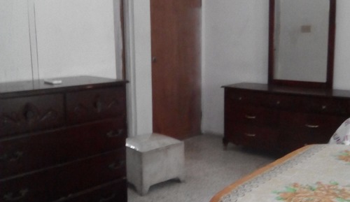 Habitación triple, varias camas