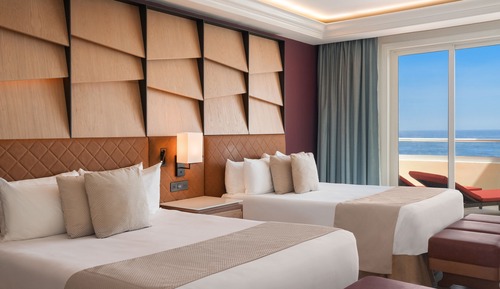 Suite junior, 2 camas dobles, frente al mar