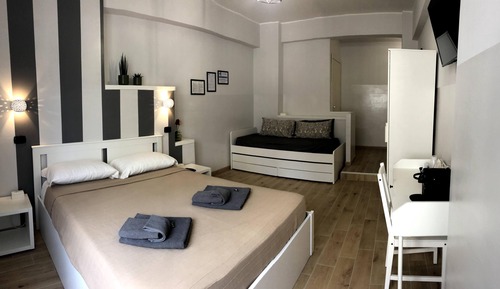 Habitación triple de lujo, varias camas, vistas a la ciudad