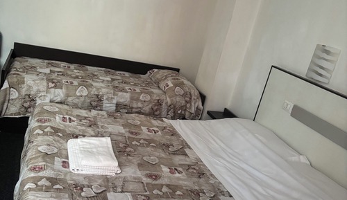 Habitación triple, varias camas