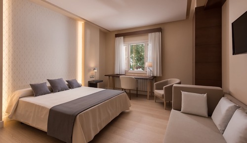 Habitación triple Deluxe, varias camas