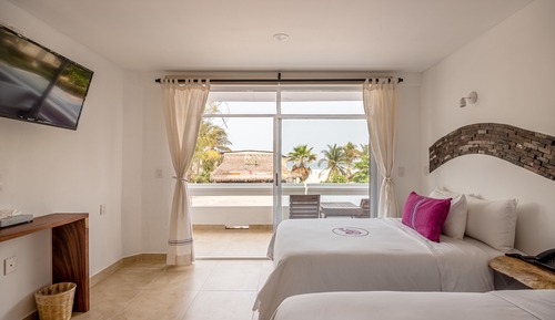 Habitación Deluxe, 2 camas dobles, vistas parciales al mar