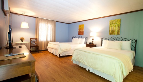 Habitación Signature, 2 camas de matrimonio, baño privado, en la zona del jardín