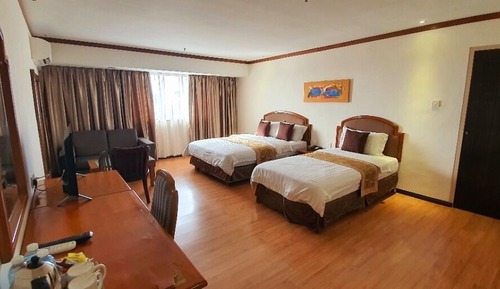 Habitación triple Deluxe, varias camas