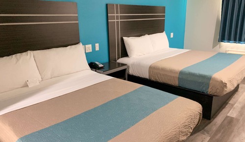 Habitación Deluxe, 2 camas de matrimonio, fumadores, frigorífico y microondas