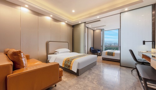 Habitación superior con 2 camas individuales, vistas a la ciudad